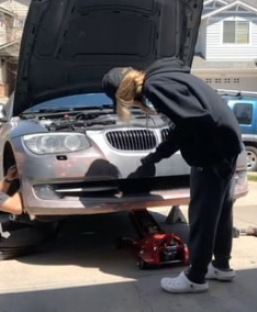 Monique wrenching in the driveway